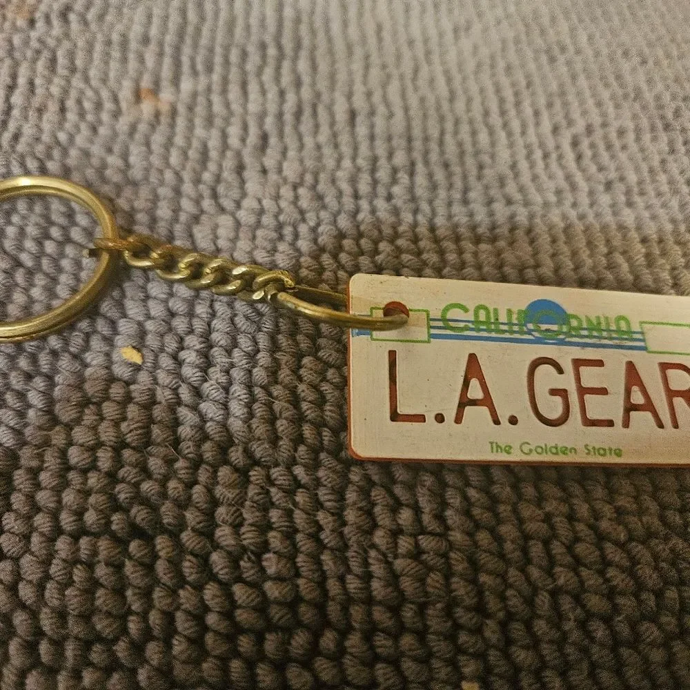 1980's L.A. Gear California license plate keychain tag